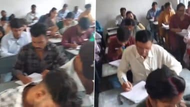Cheating in Dindori College: मध्य प्रदेश की शिक्षा का बेहाल! डिंडोरी के कॉलेज में टेबल पर किताबें और मोबाइल से छात्र कर रहे है नकल, वीडियो आया सामने (Watch Video) Cheating in Dindori College: मध्य प्रदेश की शिक्षा का बेहाल! डिंडोरी के कॉलेज में टेबल पर किताबें और मोबाइल से छात्र कर रहे है नकल, वीडियो आया सामने (Watch Video)