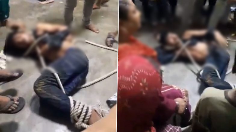 Baghpat Shocker: शादी के घर में प्रेमिका से मिलने पहुंचा युवक, हाथ पैर बांधकर लोगों ने की पिटाई, कपड़े भी फाड़े, बागपत जिले का वीडियो आया सामने;VIDEO