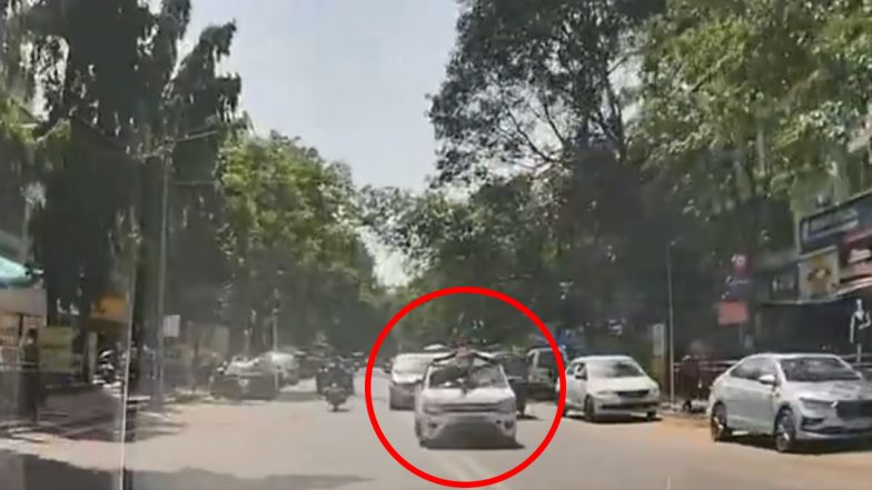 Man Hanging on Car Bonnet: तेज रफ्तार कार के बोनट पर लटका दिखा शख्स, पुणे के विमान नगर का वीडियो आया सामने (Watch Video)