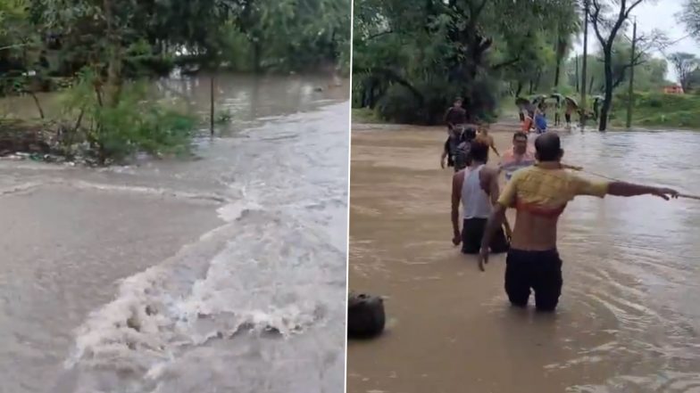 Jhansi: नाले में पानी भरने से छात्र दूसरी तरफ फंसे, शिक्षकों ने रस्सी की मदद से निकाला बाहर, झांसी जिले का वीडियो आया सामने;VIDEO