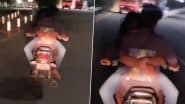 Romance on Bike: हैदराबाद में आरामघर फ्लाईओवर पर चलती बाइक पर रोमांस करते दिखे प्रेमी जोड़े, वीडियो वायरल