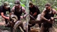 Man Catches Giant Anaconda: शख्स ने गंदे पानी में छिपे विशालकाय एनाकोंडा को नंगे हाथों से पकड़ा, देखें शॉकिंग वीडियो