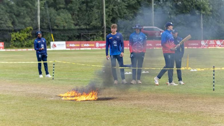 Ground Staff Set The Pitch on Fire:&nbsp;पिच को जल्दी सुखाने के लिए ग्राउंड स्टाफ ने किया आग के हवाले!&nbsp;फिरभी गीली आउटफील्ड के कारण नामीबिया बनाम स्कॉटलैंड मैच&nbsp;रद्द, देखें तस्वीर