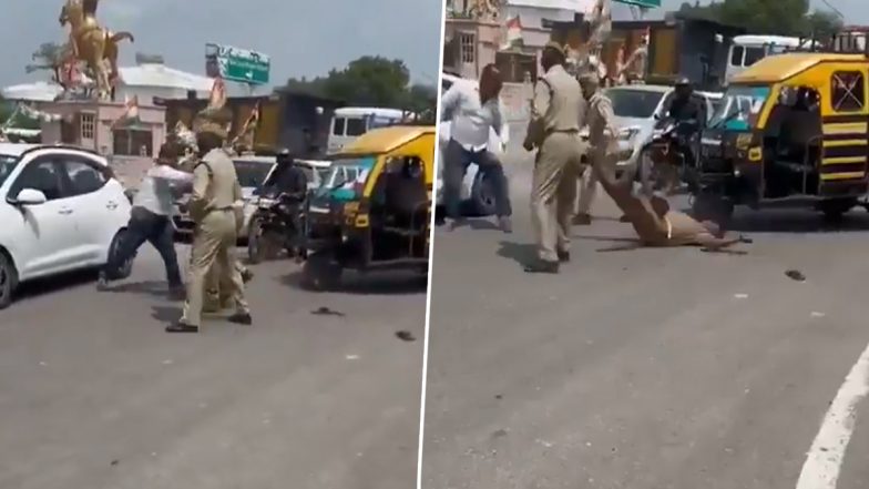 VIDEO: ऑटो रिक्शा रोके जाने से गुस्से में आया शख्स, ट्रैफिक पुलिस को मुक्का मारकर नीचे गिराया, रायबरेली का वीडियो आया सामने