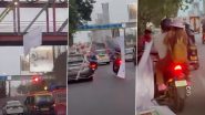 Thane Banner Collapse: मुंबई से सटे ठाणे में हादसा, बाइक सवार पर गिरा भारी बर्थडे बैनर; सुरक्षा मानकों और अवैध होर्डिंग्स पर उठे सवाल; VIDEO